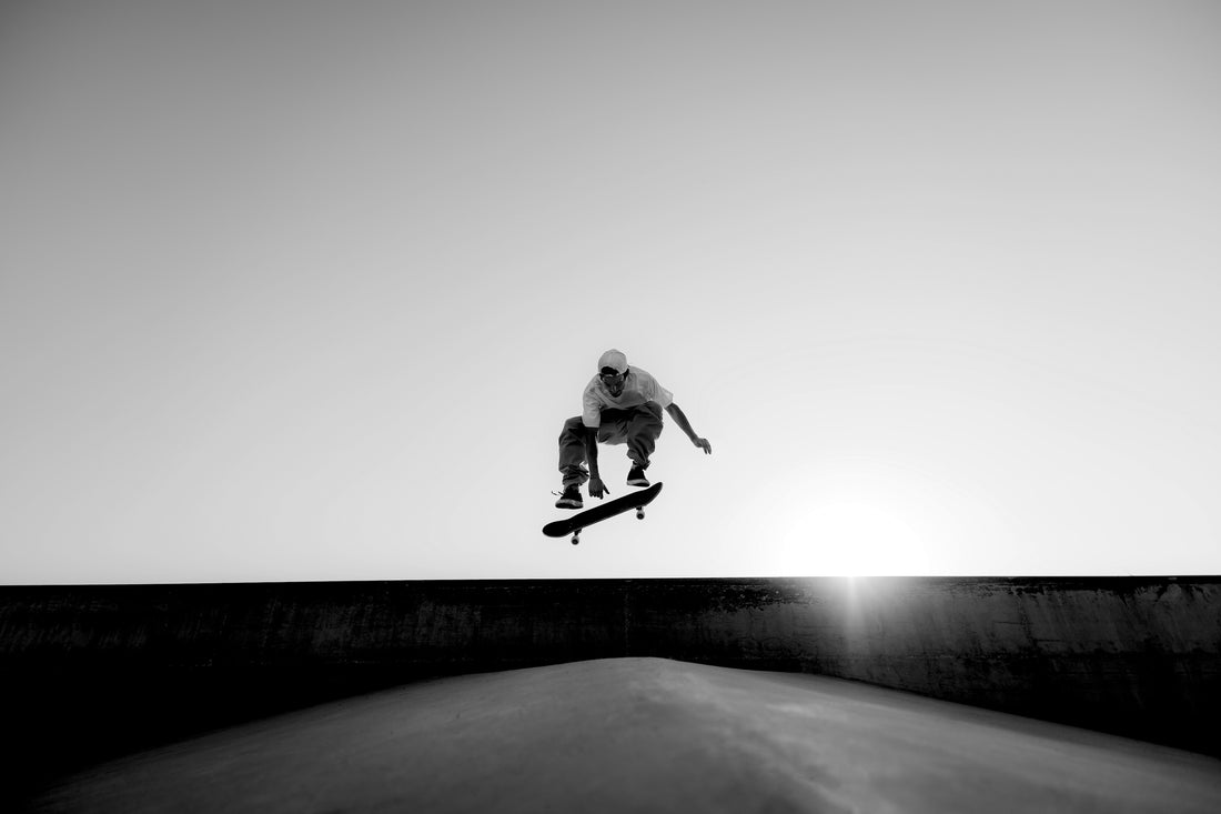 rollr clothing skate and streetwear apparel, man doing trick on skateboard