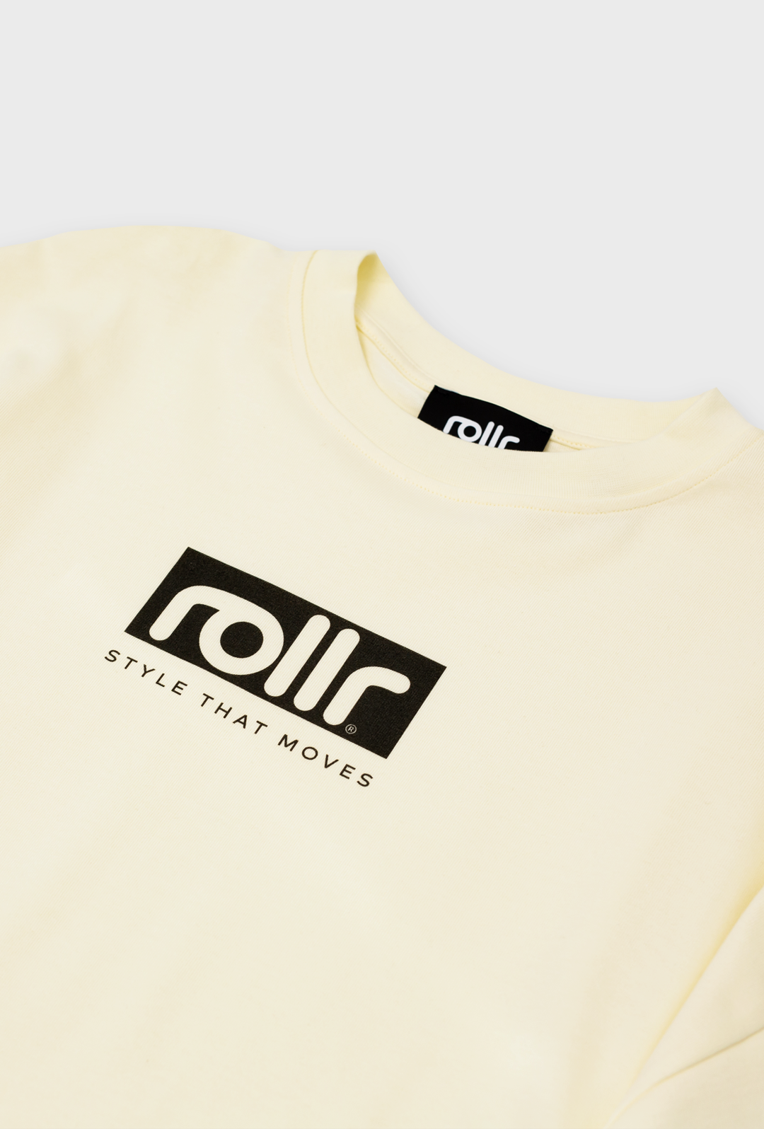 vanilla cream box fit t-shirt made from French terry fabric with black label and rollr print with style that moves tagline